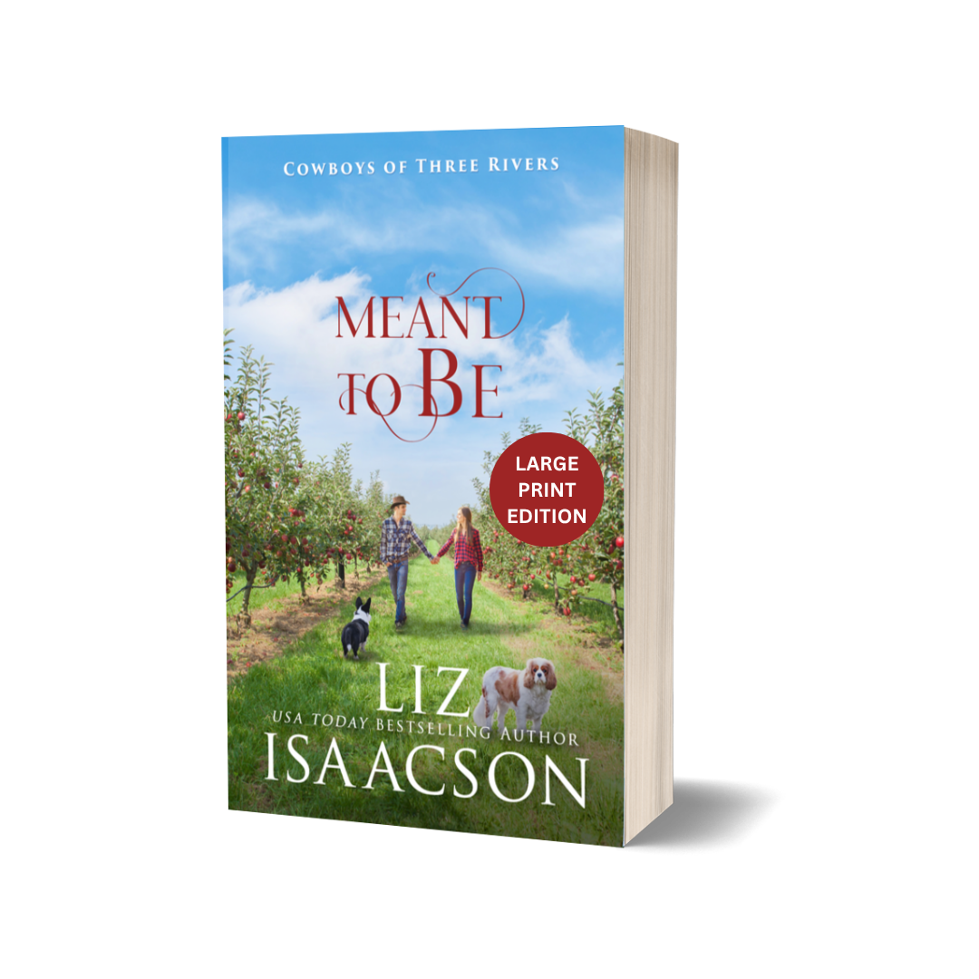 Large print paperback of 'Meant to Be' by Liz Isaacson with a couple and dogs in an orchard.