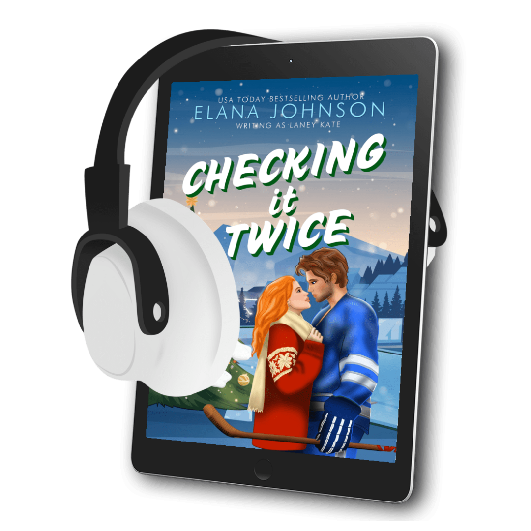 A tablet device displaying a romance novel cover titled "Checking It Twice" by Elana Johnson, with large white over-ear headphones floating beside it on a black background.