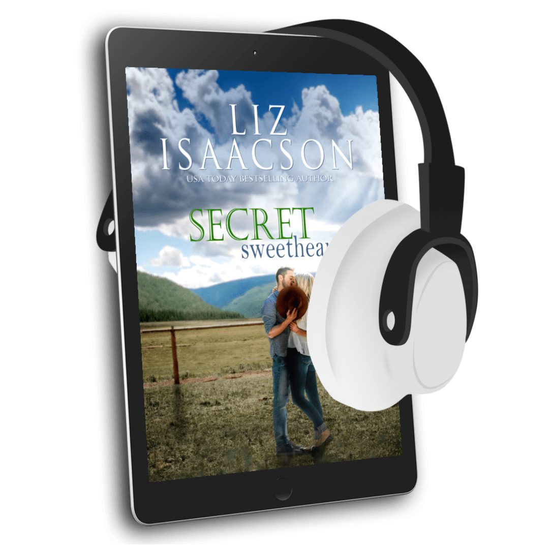E-reader with a book cover displayed on screen and headphones on top