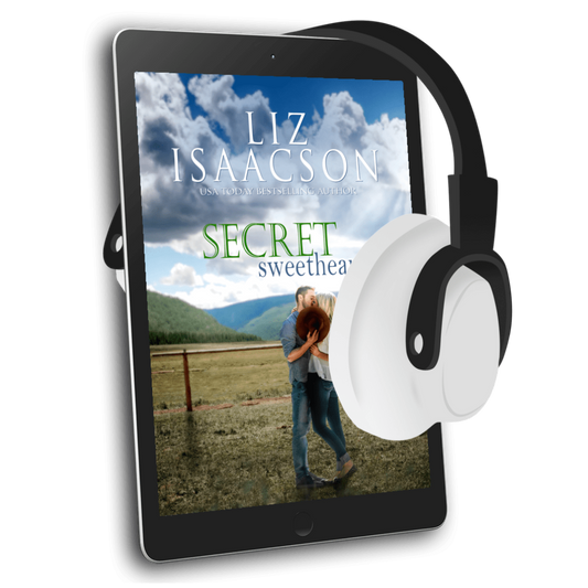 E-reader with a book cover displayed on screen and headphones on top