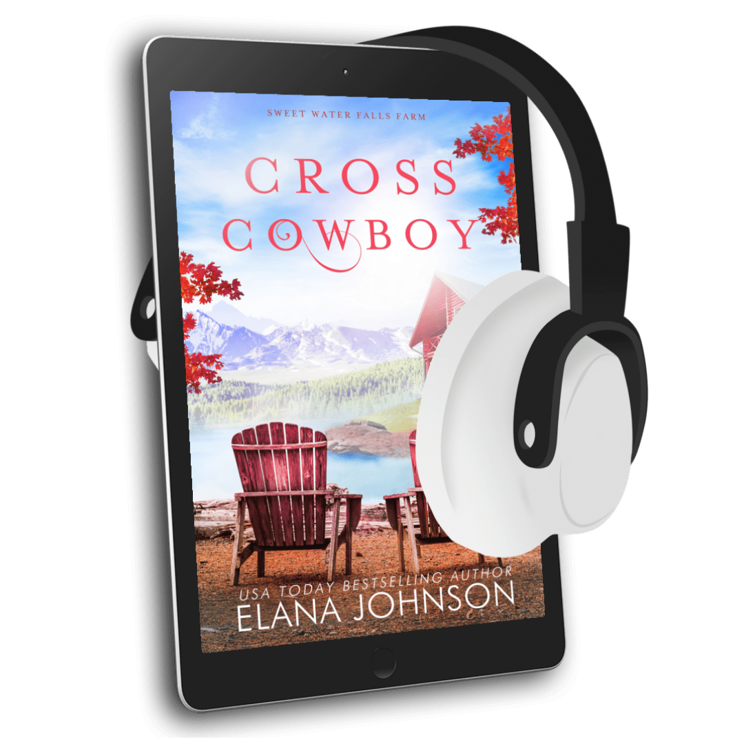 A tablet displaying the book cover of 'Cross Cowboy' by Elana Johnson, with white and black over-ear headphones draped over the right side, on a plain white background.