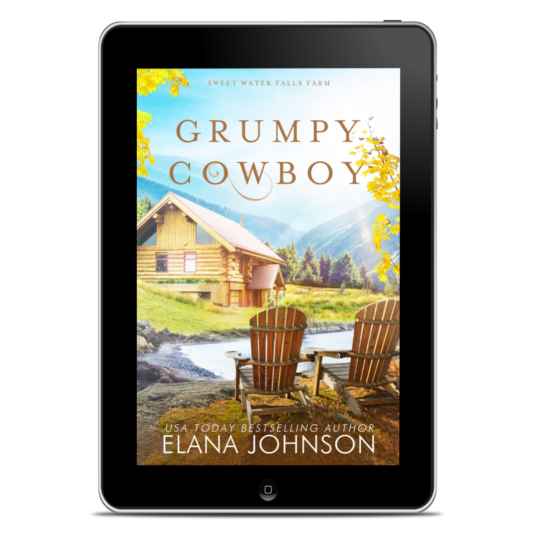 A tablet device displaying the book cover for 'Grumpy Cowboy' by Elana Johnson, set against a plain white background.