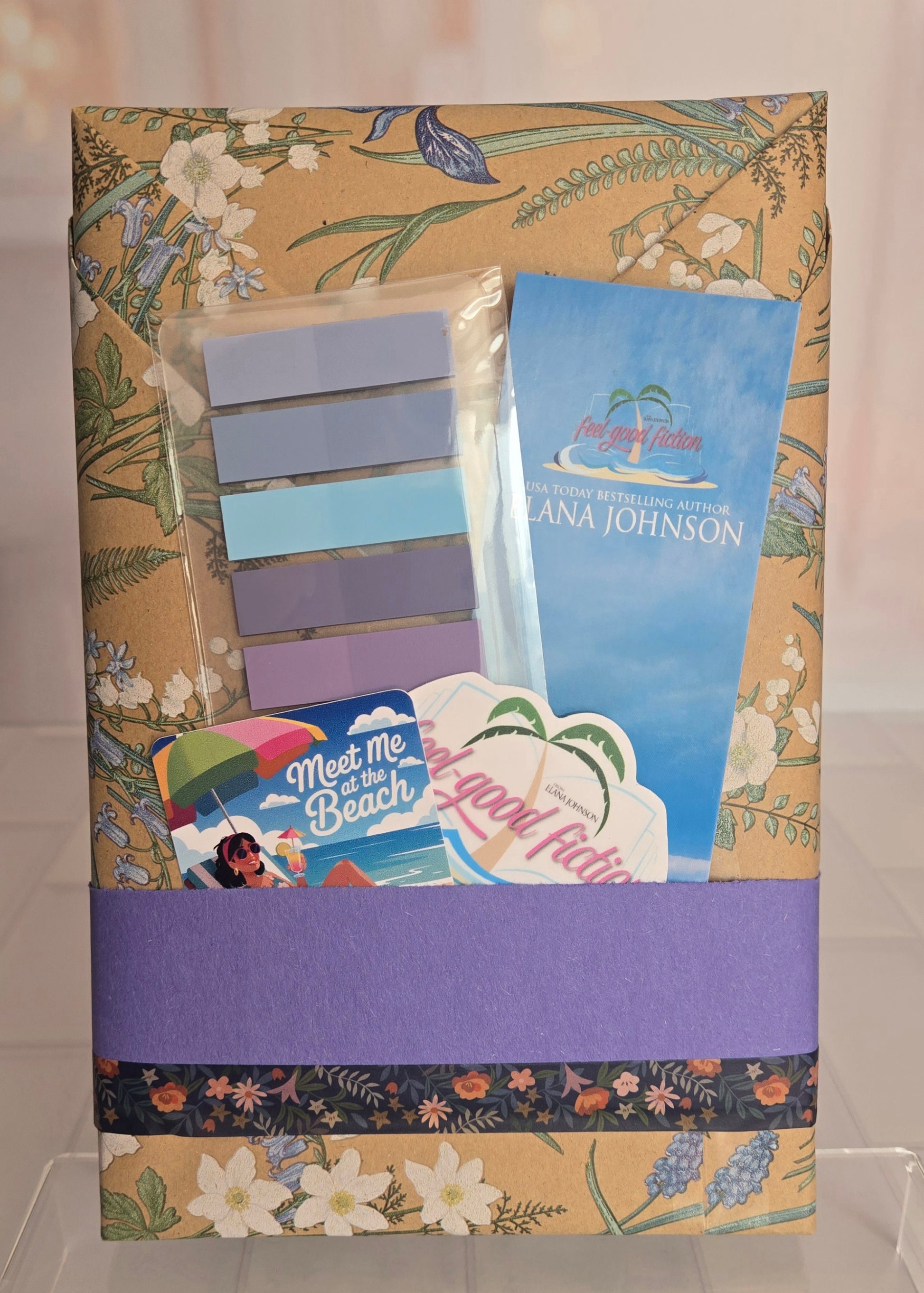 Gift package with stationery items on a floral background