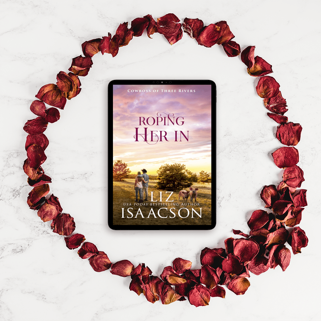 Roping Her In on a tablet surrounded by rose petals.