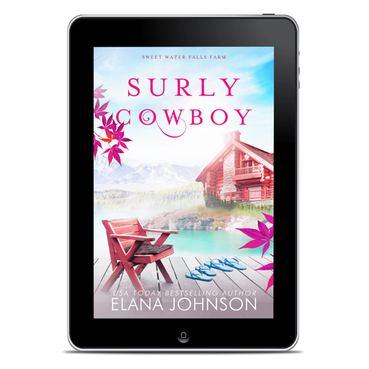 A tablet device displaying the book cover for 'Surly Cowboy' by Elana Johnson, set against a plain white background.